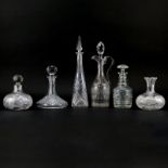 Grouping of Six (6) Assorted Crystal and Glass Decanters. Two are signed (Waterford, Czech).