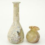 Two (2) Small Ancient Roman Glass Vases. Unsigned. Wear commensurate with age. Measures 1-3/4" H,