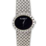 Lady's 18 Karat White Gold Bueche-Girod Bracelet Watch with Diamond Bezel and Manual Movement.