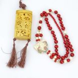 Grouping of Two (2) Japanese Jewelry Items. Includes: antique Japanese reticulated carved bone