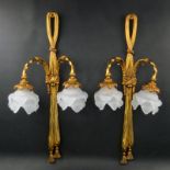 Pair of French Louis XVI Style Gilt Bronze Two Arm Wall Sconces. Decorated with foliage accents