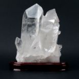 Rock Quartz Lapidary Specimen on Wooden Stand. Large faceted crystal clusters, lightly smoky.