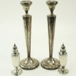 Grouping of Four (4) Sterling Silver Tableware. Includes: two weighted candlesticks and two shakers.