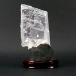 Rock Quartz Lapidary Specimen on Wooden Stand. Clear finish with various structures. Natural wear