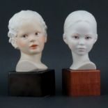 Two (2) Cybis Polychrome Porcelain Young Male and Female Busts Mounted on Wooden Bases. Both are