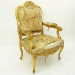 Louis XV Style Giltwood Upholstered Fauteuil. Unsigned. Wear and rubbing, needs reupholstering.