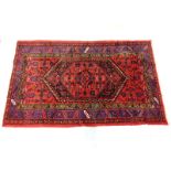 Semi-Antique Handmade Persian Style Rug. Mainly red background with blue accent and various color