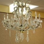 Early 20th Century Maria Theresa style 12 Light Crystal Chandelier. Adorned with crystal beaded