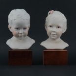 Pair of Cybis Polychrome Young Baby Boy and Girl Porcelain Busts Mounted on Wooden Bases. Signed