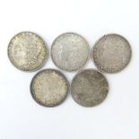 Lot of Five (5) 1882-1901 U.S. Morgan Silver Dollars. Mint mark "O" on one coin. Needs cleaning,