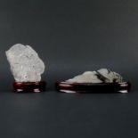 Two (2) Rock Crystal Mineral Specimen on Wooden Stands. Both are lightly smoky with black