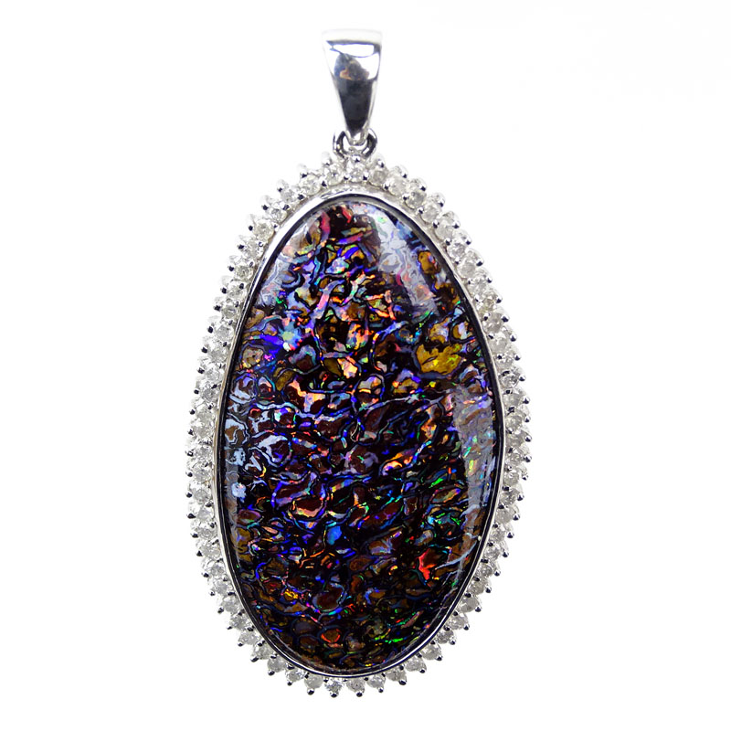 Large Black Opal and 18 Karat White Gold Pendant with Diamond Bezel. Opal measures 44mm x 24mm, good