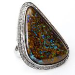 Large Black Opal and 18 Karat White Gold Ring with Diamond Bezel. Opal measures 36mm x 23mm, good