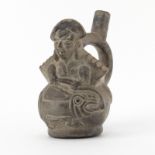 Pre Columbian or Later Blackware Chimu Inca Figural Pottery Stirrup Vessel. Depicts an effigy molded