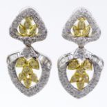 Pave Set Round Cut and Baguette Diamond and 18 Karat White and Yellow Gold Pendant Earrings.