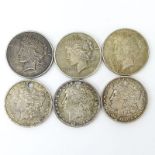 Lot of Six (6) 1879-1935 U.S. Silver Dollars. Includes: 3 Morgans and 3 Peace dollars. 3 coins