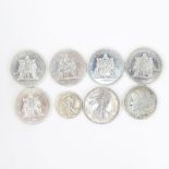 Lot of Eight (8) Silver Coins. Includes: 5 French 50 Francs coins 1977 & 1978, 1893 US Walking