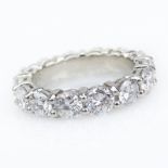 Approx. 5.0 Carat Round Brilliant Cut Diamond and Platinum Eternity Band. Diamonds G-H color, VS