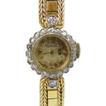 Lady's Vintage Lorett 18 Karat Yellow Gold Bracelet Watch with Diamond Bezel. Stamped 18K. Appears