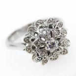 Vintage Diamond and 18 Karat White Gold Filigree Cluster Ring. Unsigned. Good condition. Ring size