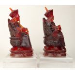 Large Pair Vintage Chinese Cherry Amber Style Emperor and Empress Figurines on Lucite Bases.