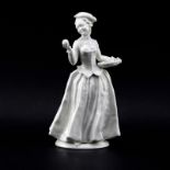 Vintage Hutschenreuther Figurine "Woman With Fruit". Signed. Repair to arm. Measures 9-3/4" H.