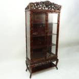 Mid Century Chinese Carved Teak Wood and Glass Display Case. Carved openwork foliage relief top