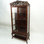 Mid Century Chinese Carved Teak Wood and Glass Display Case. Carved openwork foliage relief top