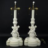 Pair of 19/20th Century Sevres Style Bisque Cherub Figural Lamps with Cherub Finials. Unsigned.