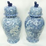 Large Pair of Matching Chinese Blue and White Porcelain Covered Urns. In a baluster form with foo