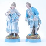 Pair of German Porcelain Male and Female Figurines. Blue crossed swords mark on underside. Some