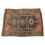 Semi-Antique Persian Rug. Some discoloration, wear to fringes and edges, dirty. Measures 69-1/2" H x