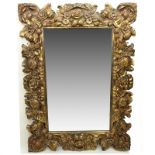 Mid 20th Century Carved Gilt Wood Decorative Mirror. Carved with deep floral relief. Good condition.