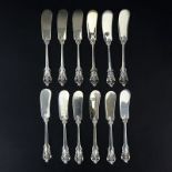 Set of Twelve (12) Wallace "Grand Baroque" Sterling Silver Butter Spreaders. Circa 1941. Stamped