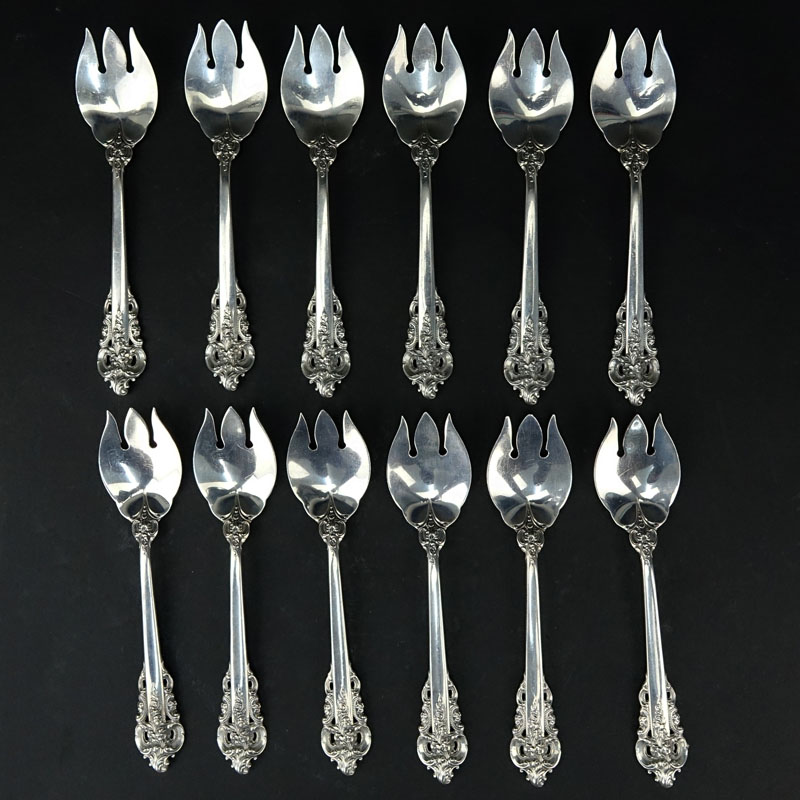 Set of Twelve (12) Wallace "Grand Baroque" Sterling Silver Ice Cream Forks. Circa 1941. Stamped