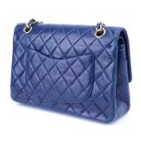 Chanel Navy Quilted Lambskin Leather Classic Double Flap Bag. Features a goldtone turnlock CC