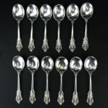 Set of Twelve (12) Wallace "Grand Baroque" Sterling Silver Round Bowl Soup Spoons. Circa 1941.