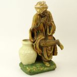 Early 20th Century Austrian Amphora Porcelain Figure, Arab Man Playing Flute. Impressed marks to