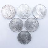 Collection of Six (6) U.S. Peace Silver Dollars. Dates range from 1922-1923. Designer initial on