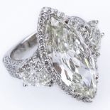 Approx. 10.64 Carat TW Diamond and 14 Karat White Gold Engagement Ring Set in the Center with a 6.64