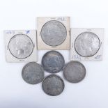 Collection of Seven (7) U.S. Silver Dollars. Includes: four Peace and three Morgan dollars. Three