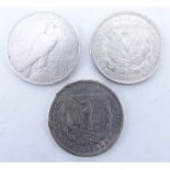 Collection of Three (3) U.S. Silver Dollars. Includes two Morgan dollars and one Peace dollar. Dates