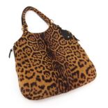 Yves Saint Laurent Printed Pony Hair Leather Hobo Style Bag. Features side zippers, leather interior