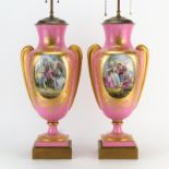 Pair of Antique Sevres Style Porcelain Urn Lamps. Gilt hand painted scrolling on rose ground with