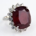 Vintage Large Oval Cut Ruby, Round Brilliant Cut Diamond and 18 Karat White Gold Ring. Ruby with
