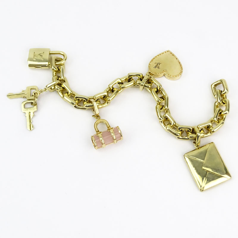 Louis Vuitton Heavy 18 Karat Yellow Gold and Pink Quartz Charm Bracelet with Four Charms. Signed,