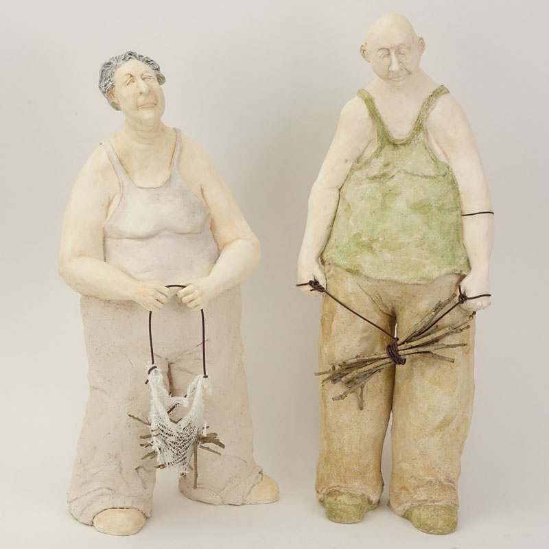 Two Contemporary Pottery Figures. Man And Woman With Sticks. Impressed initials LJK. Good condition.