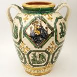 Large Italian Majolica Handled Garden Urn. Signed Pisa Italy. Repair to handle, wear, chips at base.