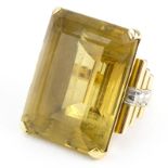 Large Retro Emerald Cut Citrine and 18 Karat Gold Ring. Topaz measures 25mm x 18mm x 14mm. Unsigned.
