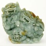 Chinese Carved Jade Carving of Two Foo Lions. Light to dark green with splashes of amber color.